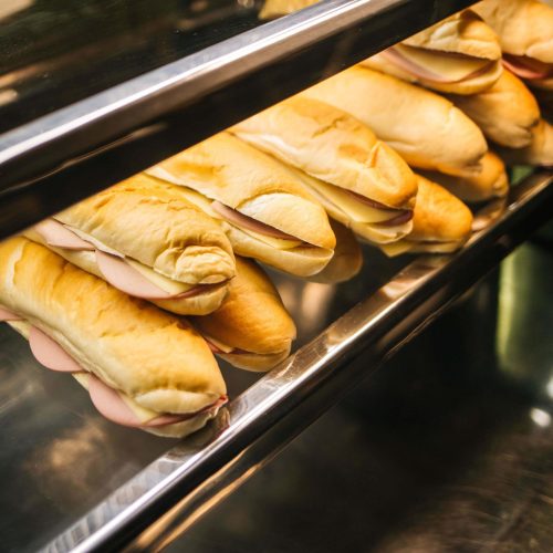 A high angle shot of tasty sandwiches on a shop shelf